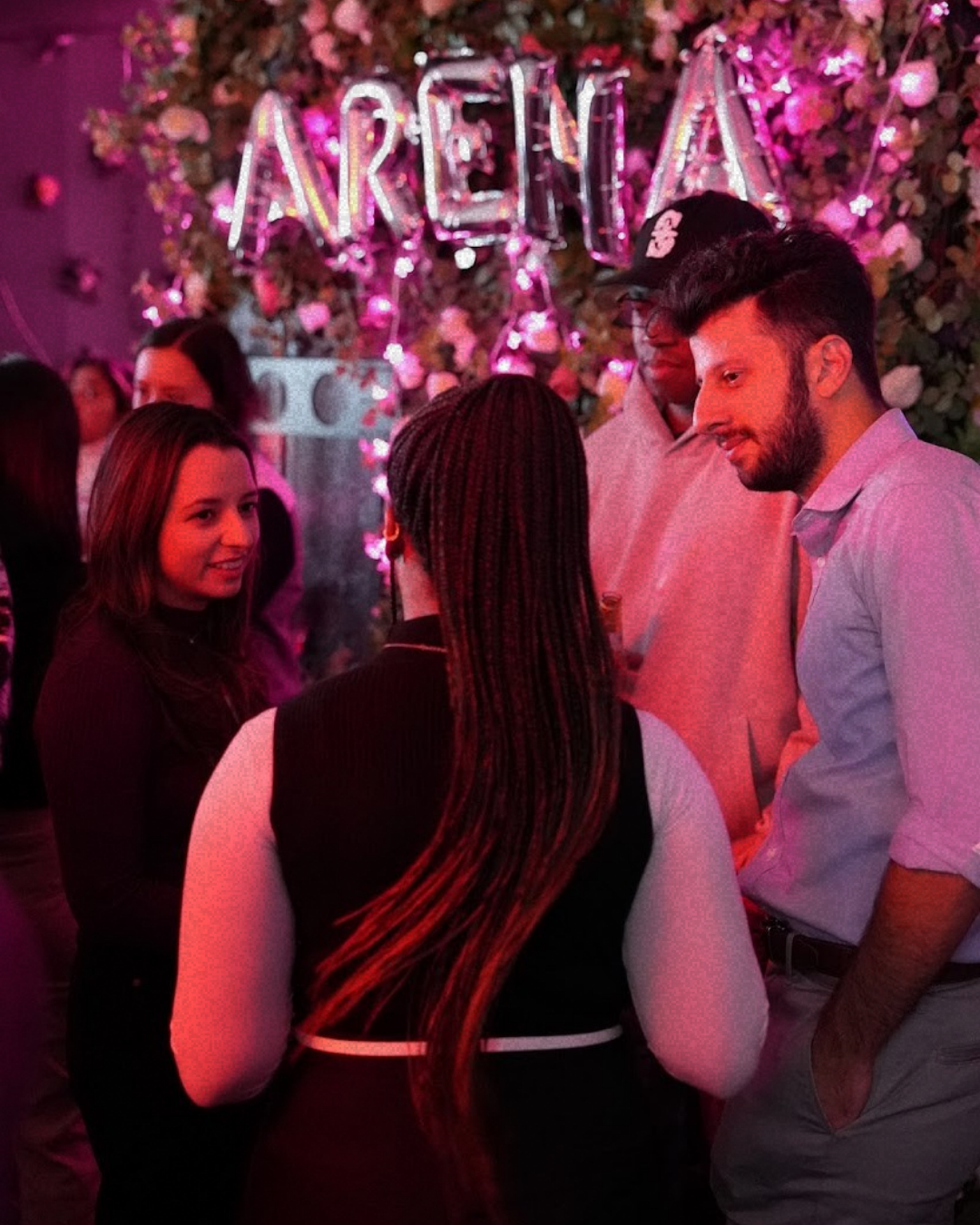 A conversation beneath Arena balloons