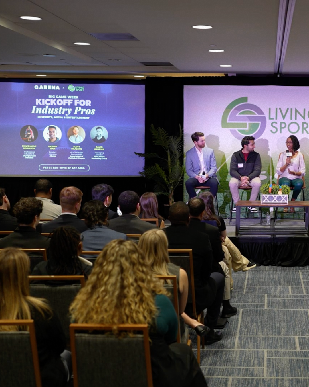 Panelists and an audience at an Arena industry workshop