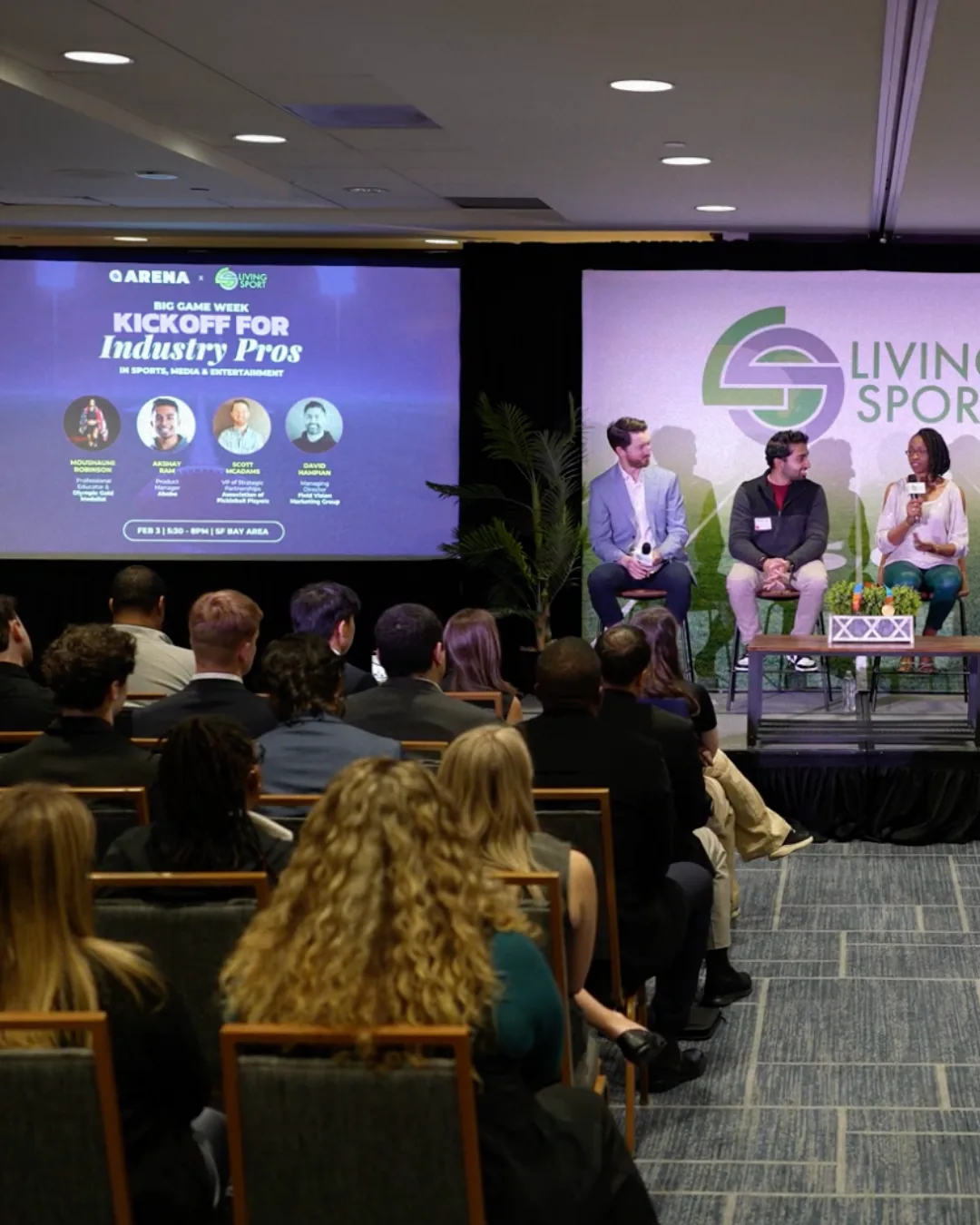 Panelists and an audience at an Arena industry workshop